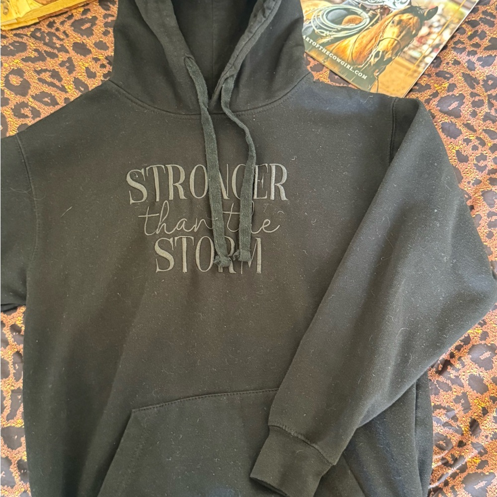 Black 'Stronger Than the Storm' Pullover Hoodie